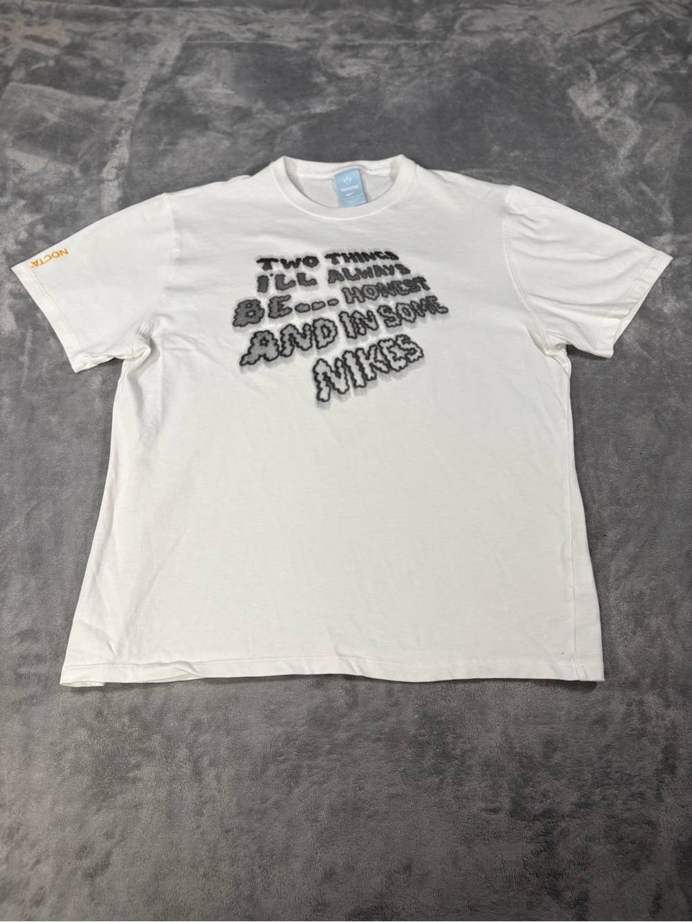 Nike White Short-Sleeve Graphic Tee with Black Text
